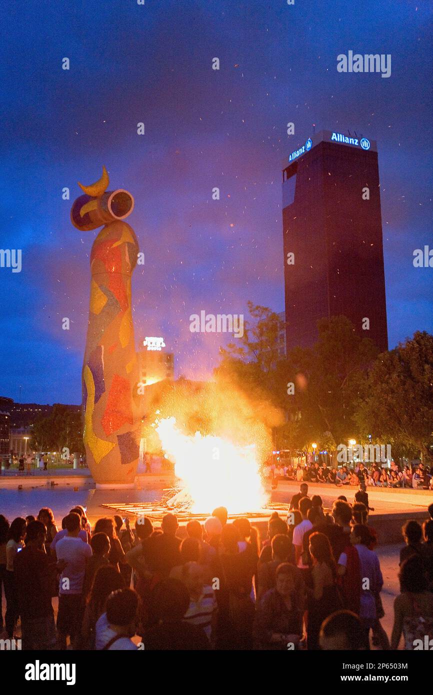 `San Joan´ Bonfire. Verbena de San Juan. In Joan Miró Park.`Dona i ocell´sculpture. Barcelona. Catalonia. Spain. Stock Photo
